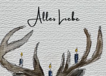 Eine Postkarte mit einem Hirsch und dem Spruch Alles Liebe