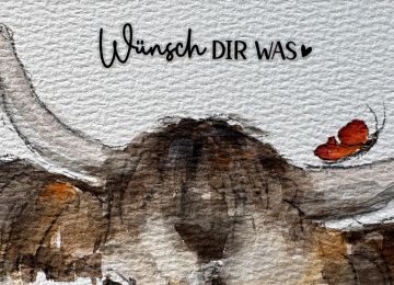 Eine Postkarte mit Kuhmotiv und dem Spruch Wünsch dir was