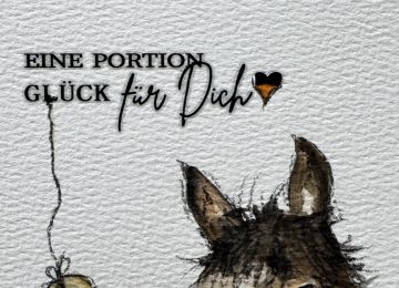 Eine Postkarte mit Pferdmotiv und dem Spruch Eine Portion Glück für dich