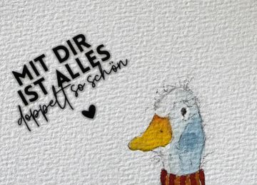 Eine Postkarte mit zwei Gänsen und dem Spruch Mit dir ist alles doppelt so schön